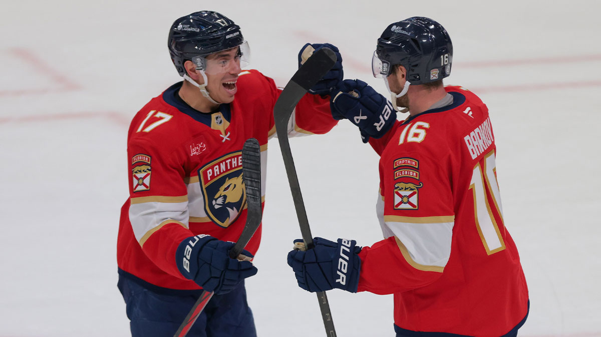 Florida Panthers center Aleksander Barkov (16) celebrates with center Evan Rodrigues (17) after scoring the game-winning goal against the St. Louis Blues during overtime at Amerant Bank Arena.