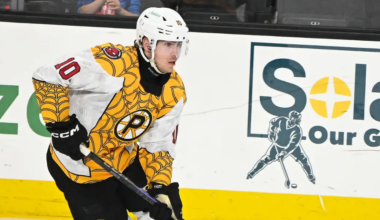 Georgii Merkulov #10 skating for the Providence Bruins in specialty Spiderman jerseys
