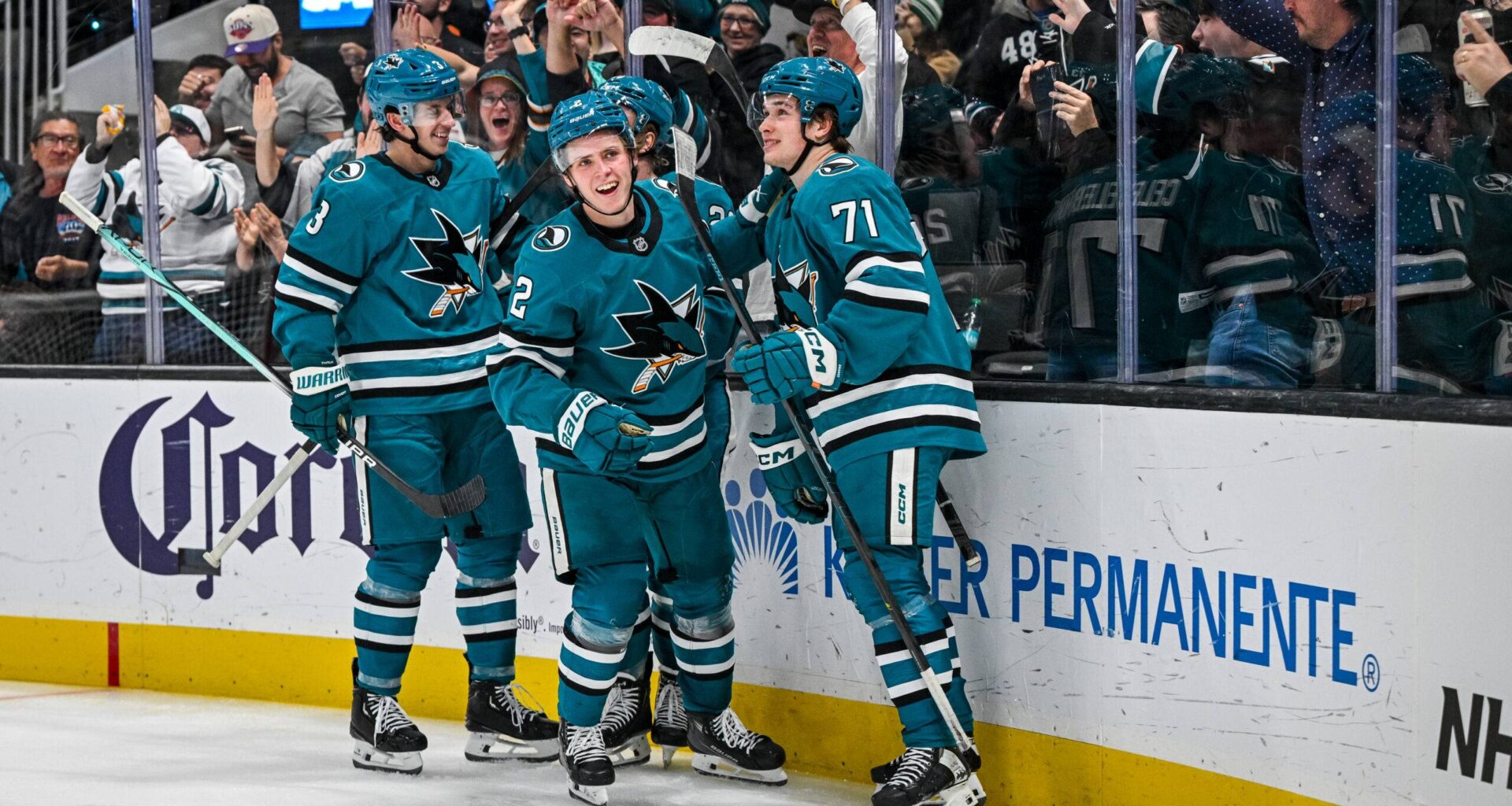 San Jose Sharks forwards Macklin Celebrini and Will Smith celebrate a goal.