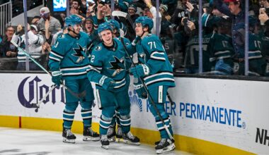 San Jose Sharks forwards Macklin Celebrini and Will Smith celebrate a goal.