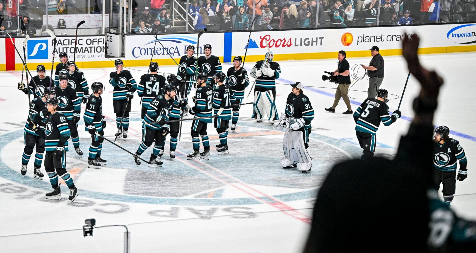 San Jose Sharks team saluting the fans after a win.
