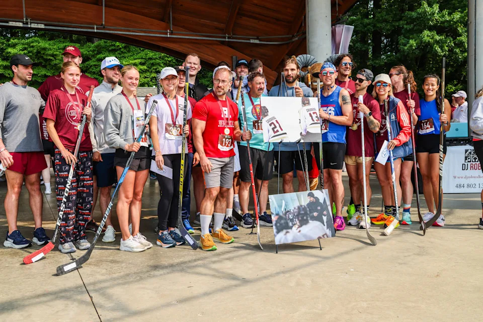 The Gaudreau family, standing along with 5k run winners at the Washington Lake Park amphitheater during Gaudreau Family 5K Run, Walk & Family Fun Day in Sewell on Saturday, May 31, 2025.