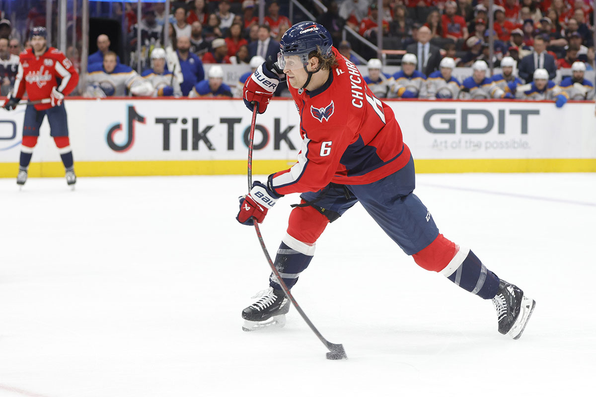 Washington Capitals defenseman Jakob Chychrun (6) shoots the puck against the Buffalo Sabres during the first period at Capital One Arena. 