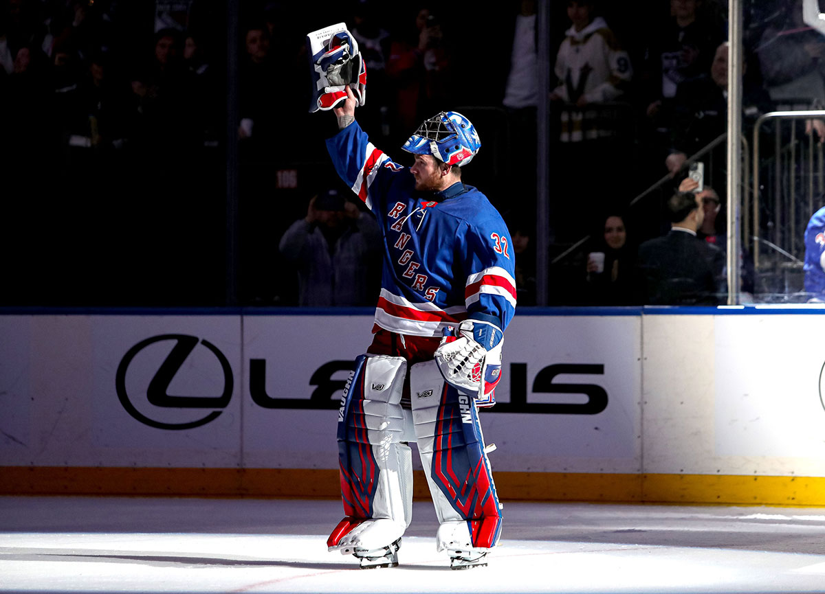 New York Rangers goalie Jonathan Quick (32) celebrates after his 400th career win following a 4-2 victory against the Vegas Golden Knights at Madison Square Garden.