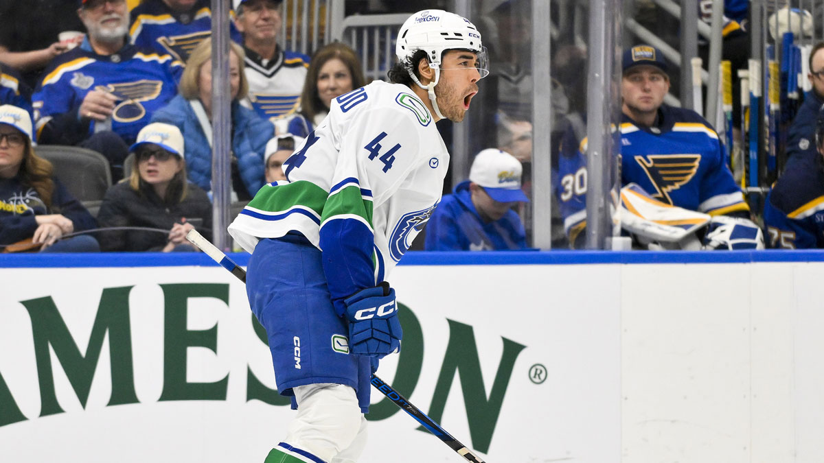 Vancouver Canucks left wing Kiefer Sherwood (44) reacts after scoring against the St. Louis Blues during the third period at Enterprise Center.