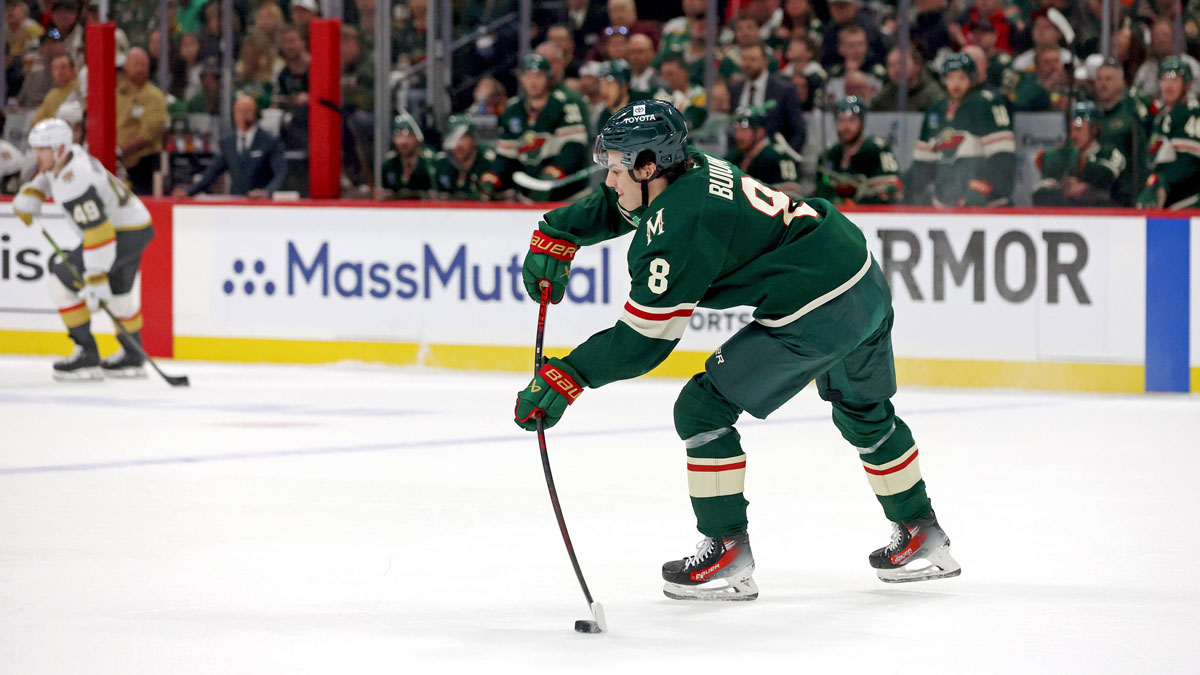 Minnesota Wild defenseman Zeev Buium (8) moves the puck during the first period in game four of the first round of the 2025 Stanley Cup Playoffs at Xcel Energy Center.