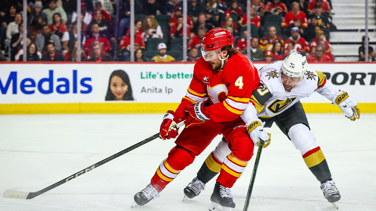 Rasmus Andersson battles for the puck.