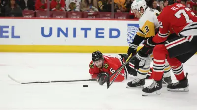 Apr 6, 2025; Chicago, Illinois, USA; Chicago Blackhawks defenseman Sam Rinzel (6), defenseman Alex Vlasic (72) and Pittsburgh Penguins right wing Kevin Hayes (13) battle for control of the puck during the second period at United Center.