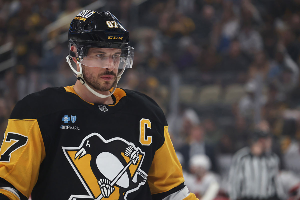 Pittsburgh Penguins center Sidney Crosby (87) looks on at the face-off circle against the Ottawa Senators during the first period at PPG Paints Arena. 