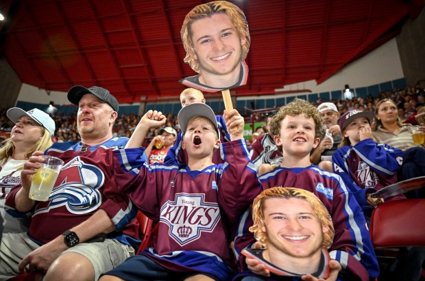 Young Kings players Ryker Wellman (left) and Mikey Jend cheer for their coach Kyle Ostrow (19) of the DU Pioneers during the second period of an exhibition game against the Colorado Avalanche at Magness Arena on Sunday, Aug., 24, 2025. (Photo by AAron Ontiveroz/The Denver Post)
