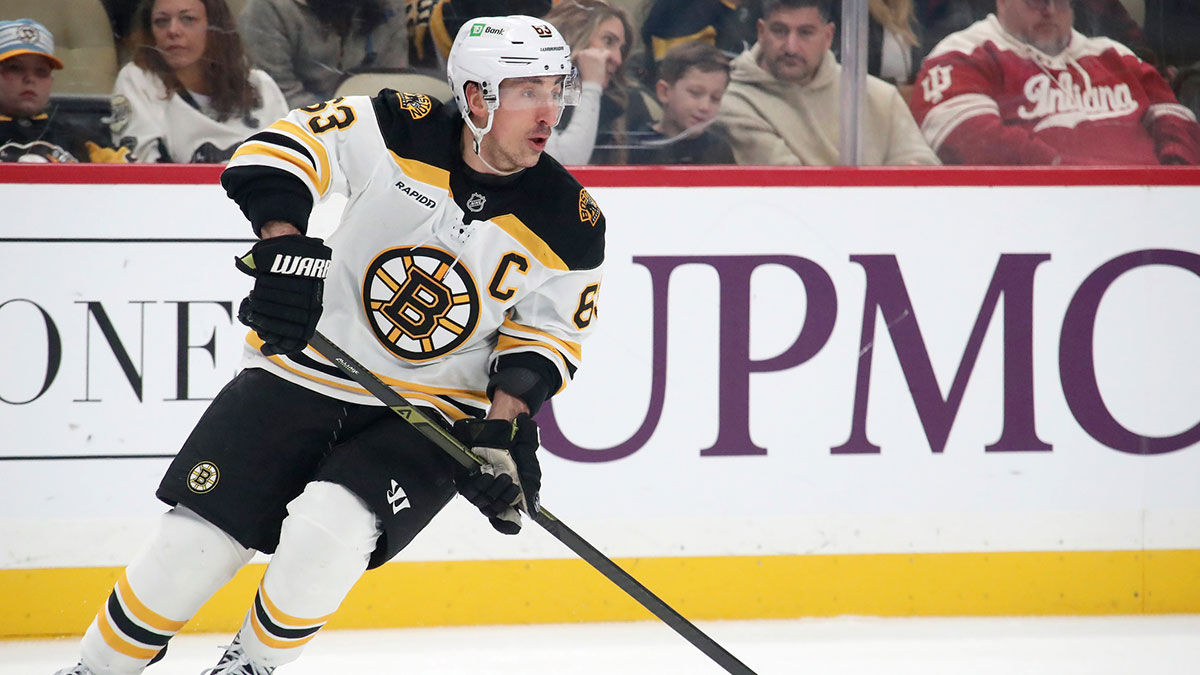 Boston Bruins left wing Brad Marchand (63) skates with the puck against the Pittsburgh Penguins during the first period at PPG Paints Arena. 