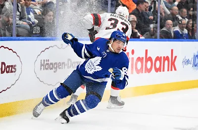 Toronto Maple Leafs forward Nick Robertson reacts during 2025 game.