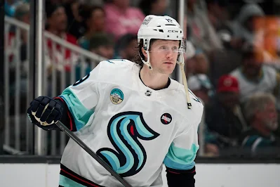 Seattle Kraken's Jared McCann reacts during 2025 game.