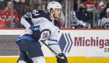DETROIT, MI - JANUARY 13: Dylan Samberg #54 of the Winnipeg Jets turns up ice during the first period of an NHL game against the Detroit Red Wings at Little Caesars Arena on January 13, 2021 in Detroit, Michigan. Winnipeg defeated Detroit 3-0. (Photo by Dave Reginek/NHLI via Getty Images)