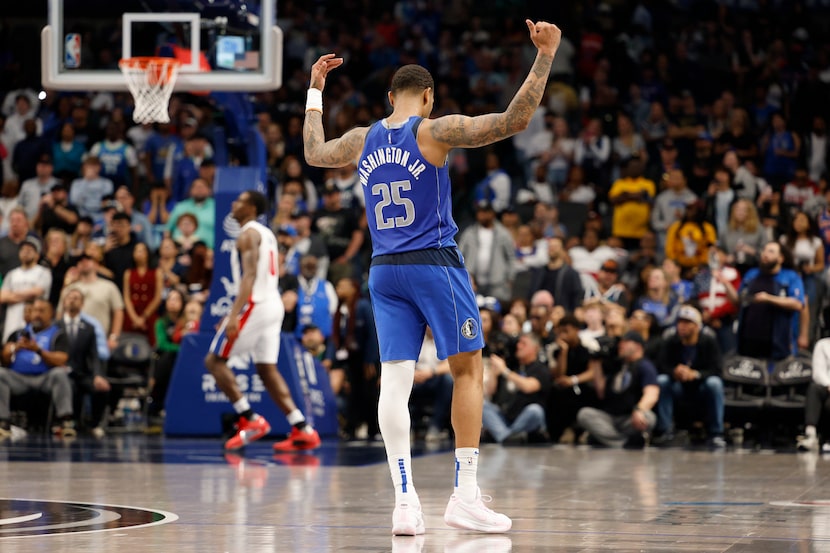 Dallas Mavericks forward P.J. Washington (25) pumps up the crowd as they close out a win...