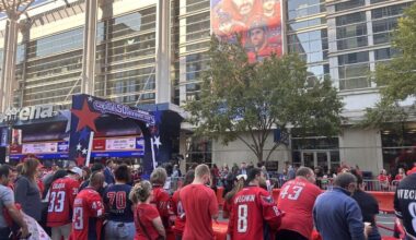 Fans watch as the Capitals walk the red carpet into their 50th season opener