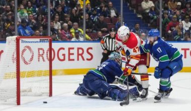 Calgary Flames battle back to win 6-5 over Vancouver Canucks in OT