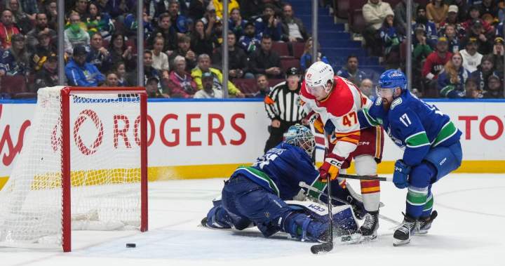 Calgary Flames battle back to win 6-5 over Vancouver Canucks in OT
