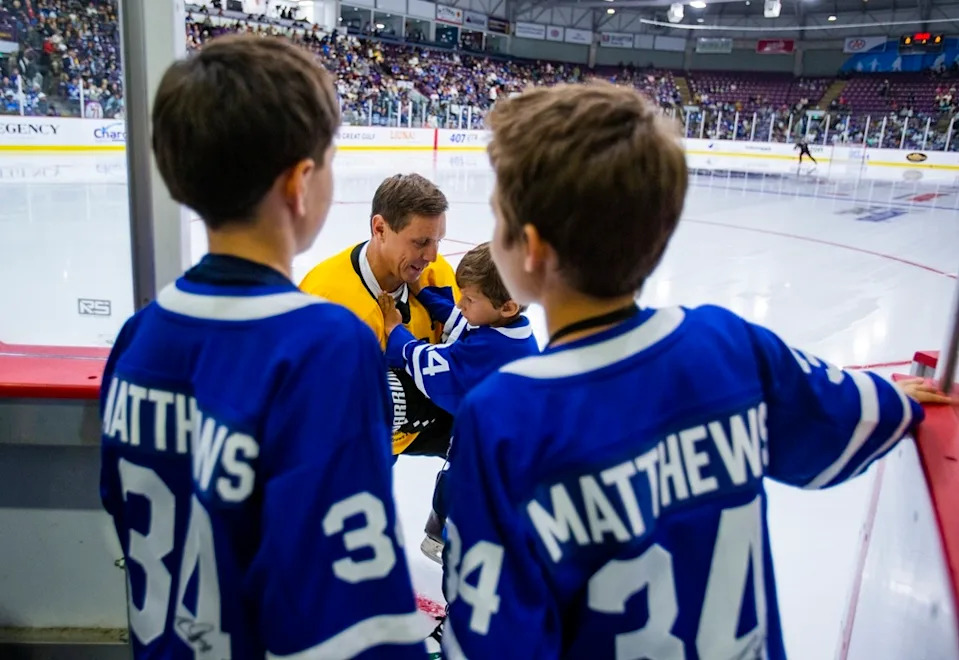  Brampton Mayor Patrick Brown and his son Theodore, 6, share a tender moment before game action at Hockey Night in Brampton at the CAA Centre. Looking onto the ice are nephews Christian and Colton. ERNEST DOROSZUK/TORONTO SUN