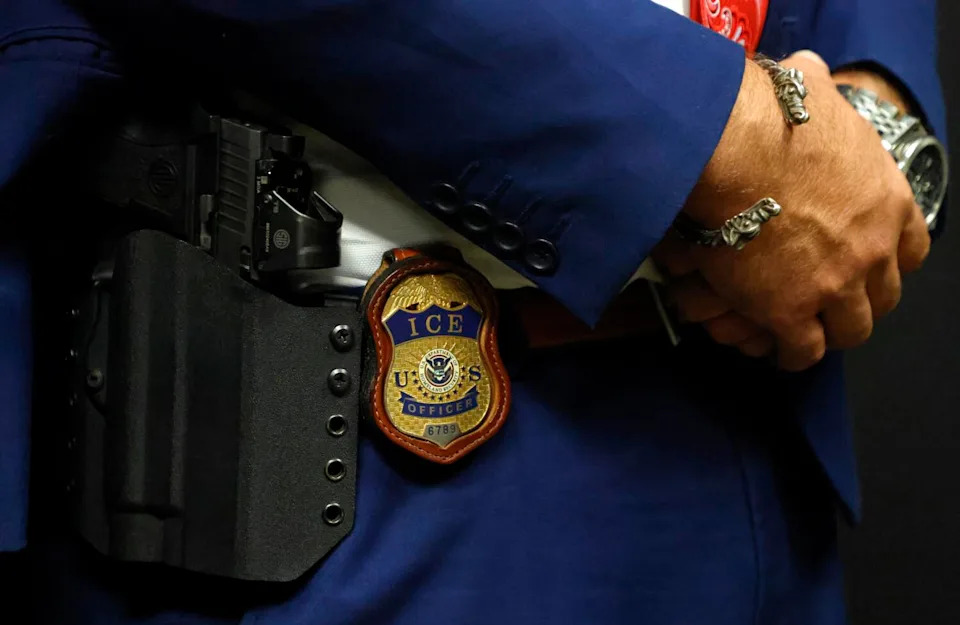 A detailed view of the badge worn by the deputy assistant director of ICE field operations.
