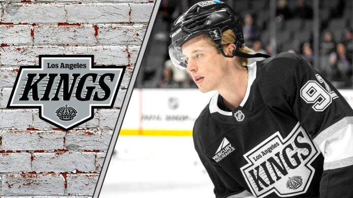 LA Kings defenseman Brandt Clarke skates with the puck during an NHL game