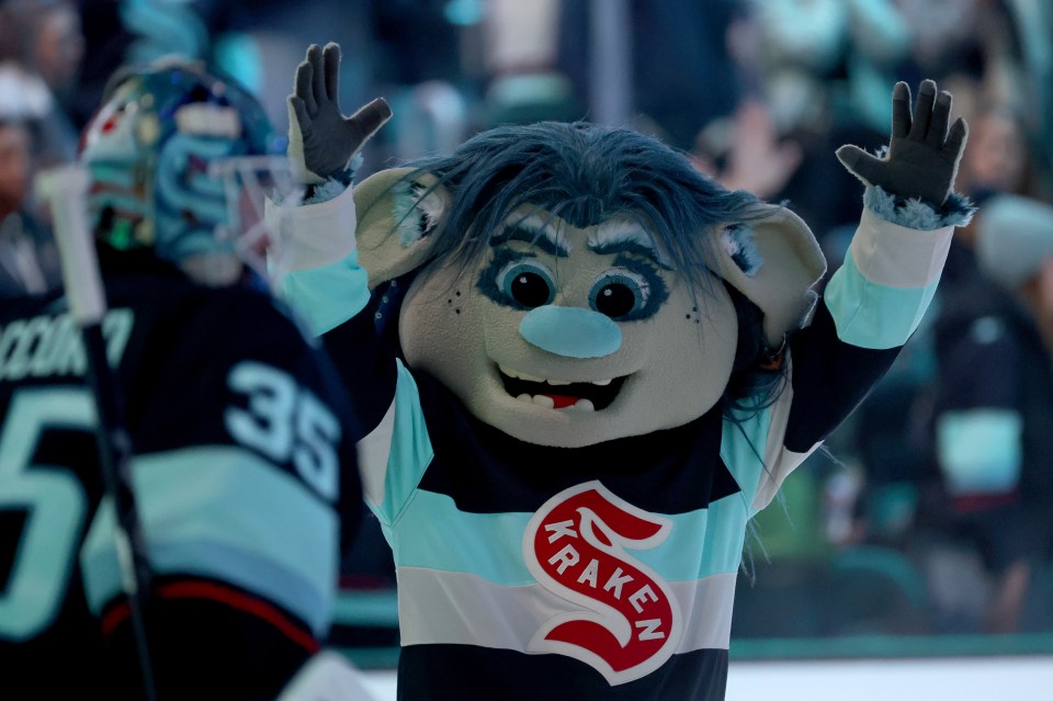 The Seattle Kraken mascot, Buoy, celebrates a win.