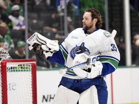 Vancouver Canucks goaltender Thatcher Demko stands by the net in the first period of an NHL hockey game against the Dallas Stars in Dallas, Tuesday, April 8, 2025.