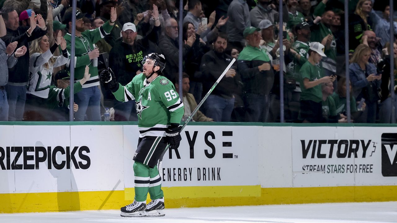 Dallas Stars center Matt Duchene skates toward the punch after scoring in the second period of an NHL hockey game against the Minnesota Wild in Dallas, Monday, March 24, 2025. (AP Photo/Gareth Patterson)