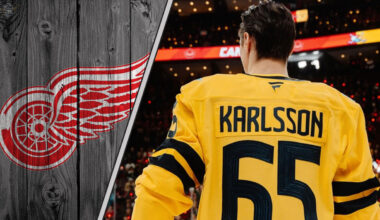 Pittsburgh Penguins forward Erik Karlsson standing on the ice with the Detroit Red Wings logo to the left as NHL trade rumors swirl around him