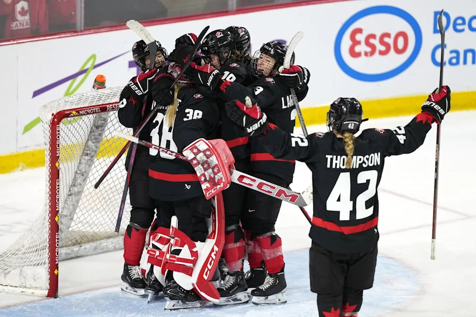 Members of Team Canada celebrate their 3-1 victory over Team USA in the final game of Rivalry Series hockey action in Summerside, P.E.I. on Saturday, Feb. 8, 2025. THE CANADIAN PRESS/Darren Calabrese