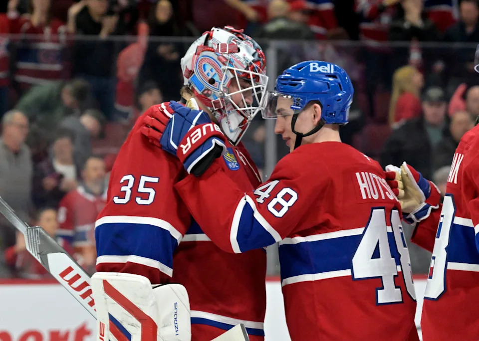 Montreal Canadiens goalie Sam Montembeault (35) and teammate defenseman Lane Hutson (48) celebrate a win.Eric Bolte-Imagn Images
