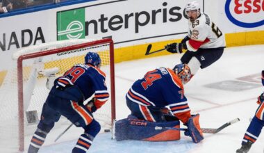 Florida Panthers' Brad Marchand (63) scores on Edmonton Oilers goalie Stuart Skinner (74) as Leon Draisaitl (29) defends during the second overtime period in Game 2 of the NHL Stanley Cup final in Edmonton, Friday, June 6, 2025. (Jason Franson/The Canadian Press via AP)
