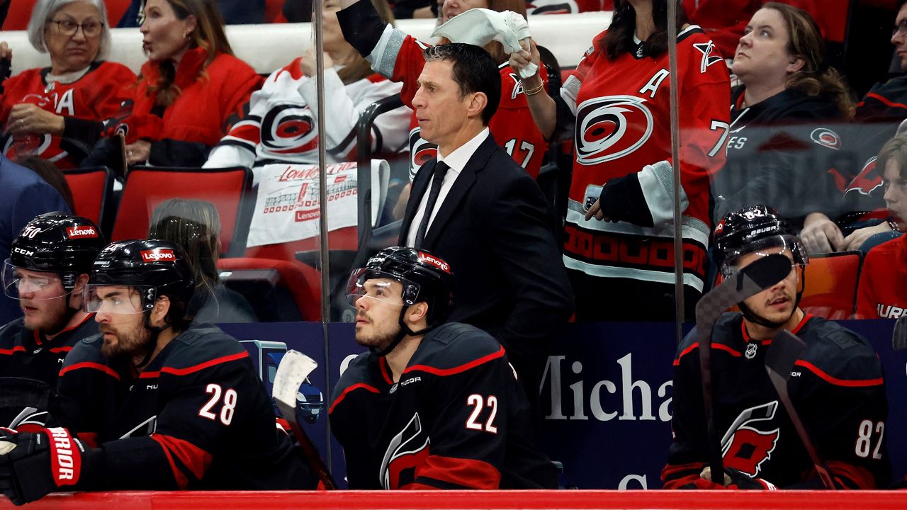 Carolina Hurricanes coach Rod Brind'Amour watches from the bench during Game 3 of an NHL hockey semifinal round playoff series against the Washington Capitals in Raleigh, N.C., Saturday, May 10, 2025. (AP Photo/Karl DeBlaker)