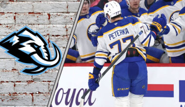 JJ Peterka celebrating a goal with the Utah Mammoth logo to the left of the image