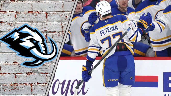 JJ Peterka celebrating a goal with the Utah Mammoth logo to the left of the image