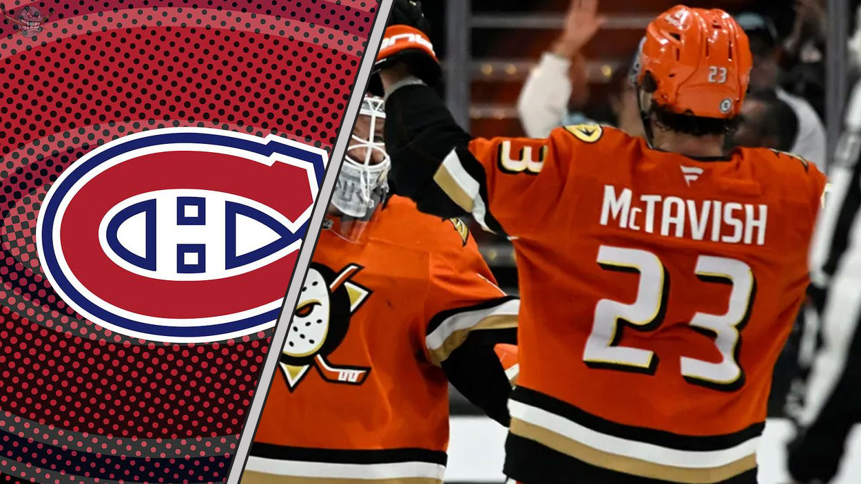 Mason McTavish of the Anaheim Ducks skates with the puck, amidst NHL trade rumors linking him to the Montreal Canadiens.