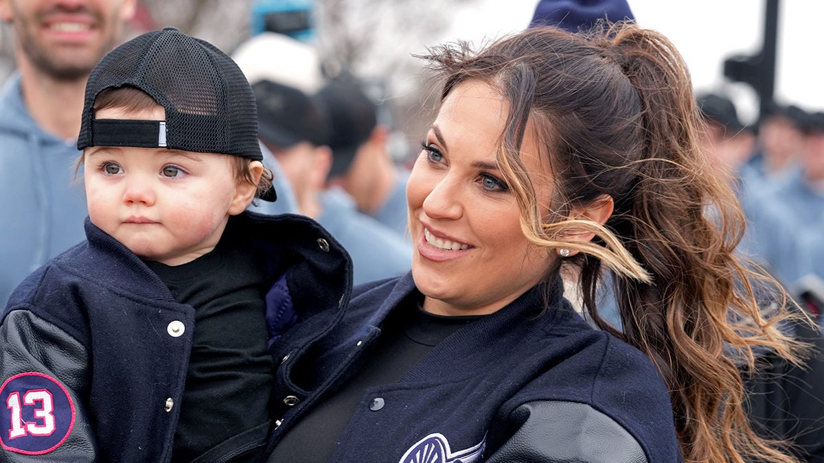 Meredith Gaudreau enters stadium with son