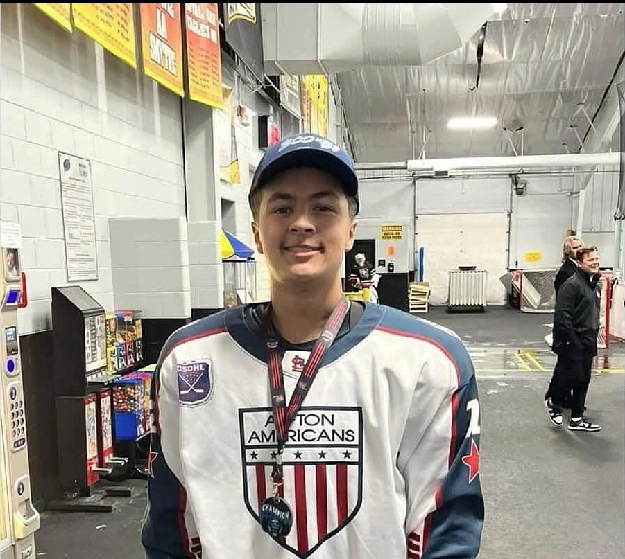 Portrait of Colin Brown in a hockey jersey.