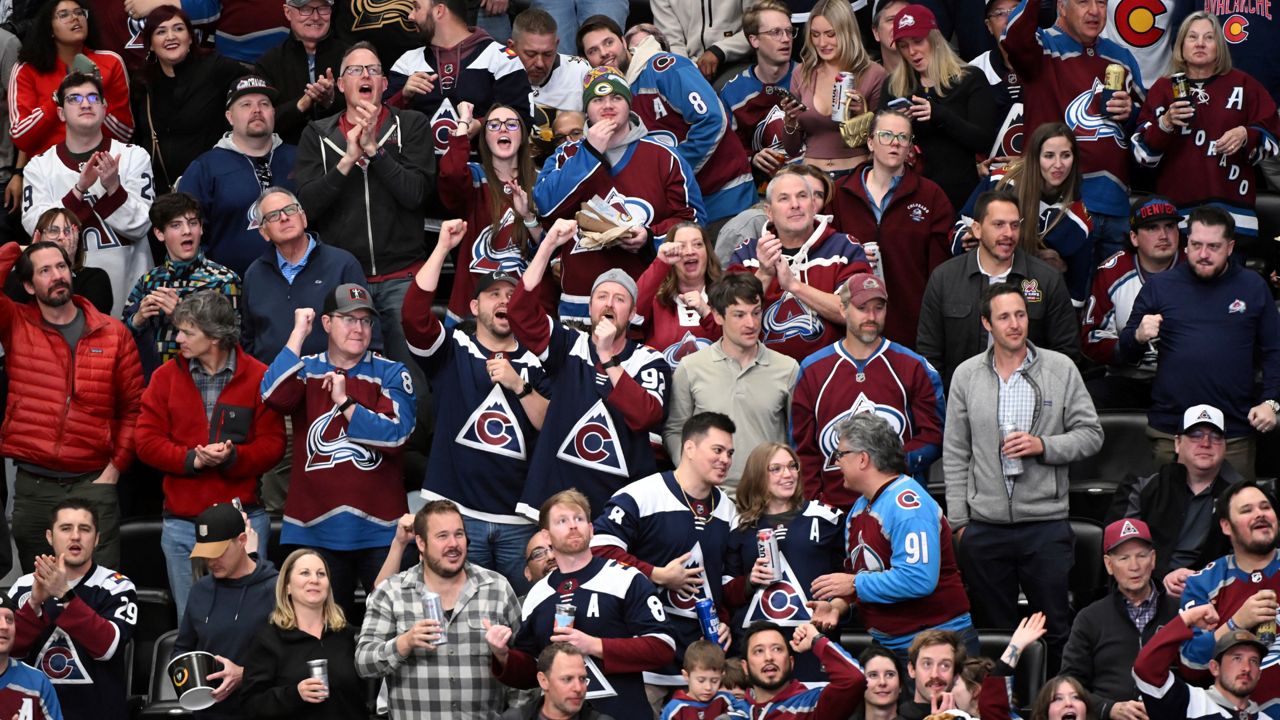 Colorado Avalanche fans cheer after a goal against the Vegas Golden Knights in the second period of an NHL hockey game Tuesday, April 8, 2025, in Denver.
