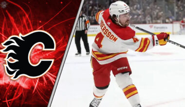 Calgary Flames defenseman Rasmus Andersson taking a shot during an NHL game, with a focus on the ongoing NHL trade rumors surrounding him