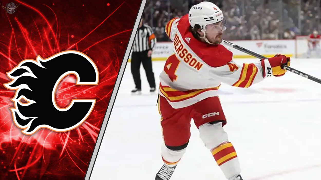 Calgary Flames defenseman Rasmus Andersson taking a shot during an NHL game, with a focus on the ongoing NHL trade rumors surrounding him