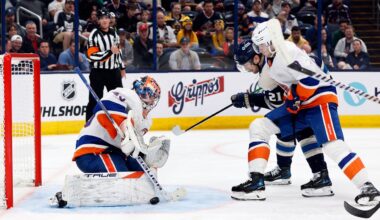 New York Islanders' Semyon Varlamov, left, makes a save as teammate Noah Dobson, right, and Columbus Blue Jackets' James van Riemsdyk look for the rebound during the second period of an NHL hockey game Wednesday, Oct. 30, 2024, in Columbus, Ohio. (AP Photo/Jay LaPrete)