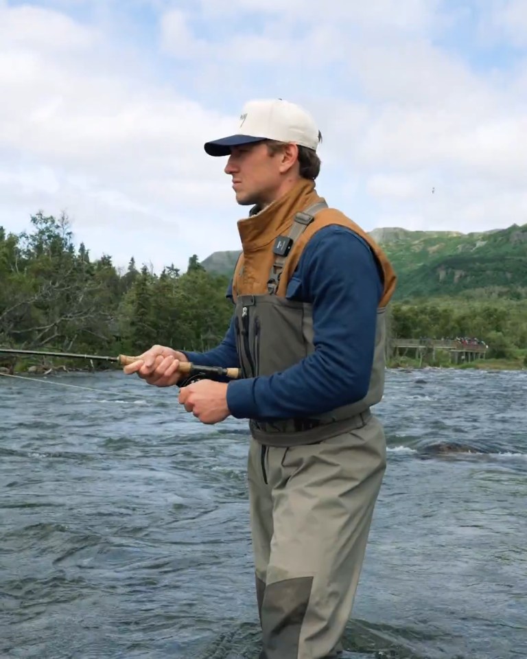 John Hayden fly fishing in a river.