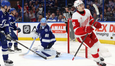 Apr 11, 2025; Tampa, Florida, USA; Detroit Red Wings right wing Alex DeBrincat (93) shoots and scores the game winning goal against the Tampa Bay Lightning during overtime at Amalie Arena. Mandatory Credit: Kim Klement Neitzel-Imagn Images