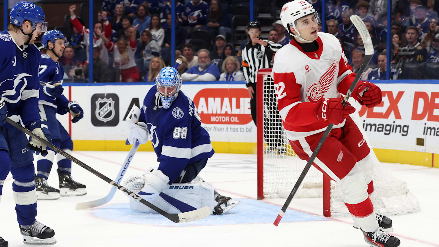 Apr 11, 2025; Tampa, Florida, USA; Detroit Red Wings right wing Alex DeBrincat (93) shoots and scores the game winning goal against the Tampa Bay Lightning during overtime at Amalie Arena. Mandatory Credit: Kim Klement Neitzel-Imagn Images
