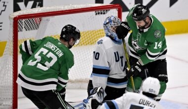 Apr 12, 2025; Dallas, Texas, USA; Dallas Stars left wing Jamie Benn (14) collides with Utah Hockey Club goaltender Karel Vejmelka (70) in the crease during the third period at the American Airlines Center. Mandatory Credit: Jerome Miron-Imagn Images