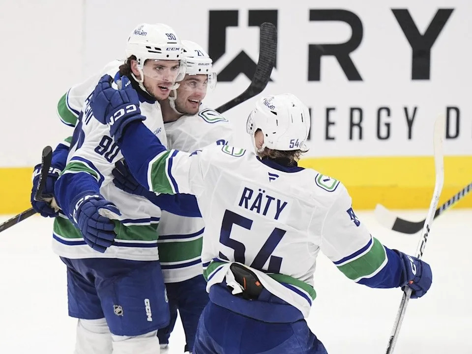 Vancouver Canucks defenceman Victor Mancini is congratulated after a power-play goal against the Stars on April 8 in Dallas.