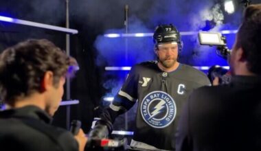 Do Lightning players prefer to smile or snare in media day photos?