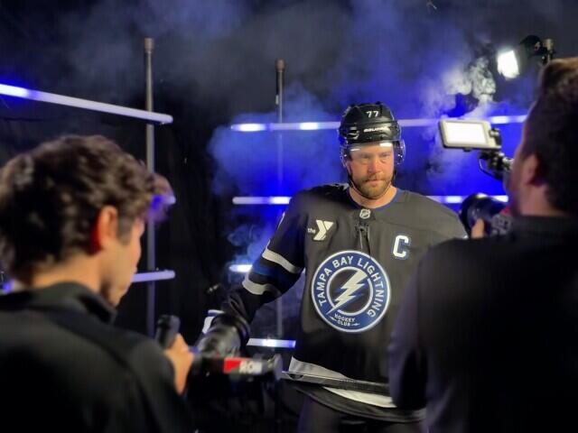 Do Lightning players prefer to smile or snare in media day photos?