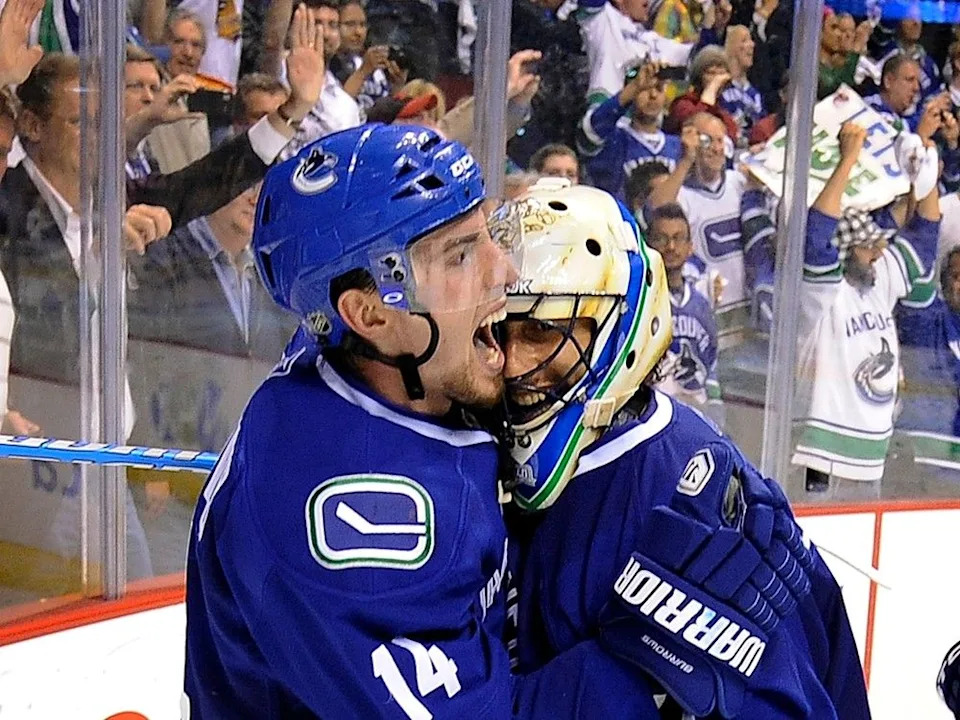  Alex Burrows celebrates with Roberto Luongo after Canucks claimed the Western Conference crown in 2011.